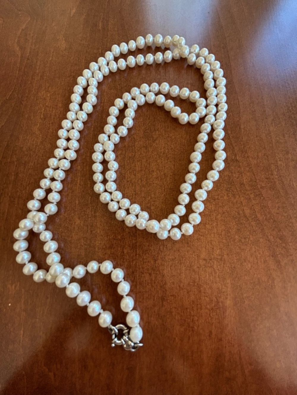 FAUX PEARL STRAND approximately 53 inches.